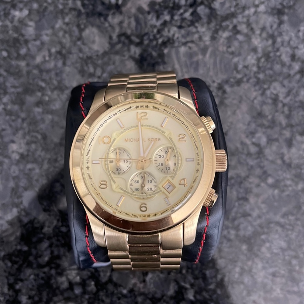Used Michael Kors watch. Shows signs on wear. Needs a new battery